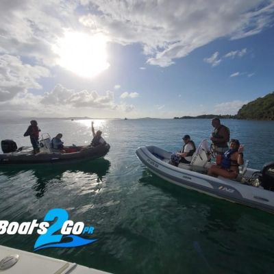 a group of people in a boat on a body of water