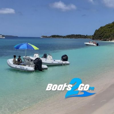 a group of people sitting in a boat on a body of water