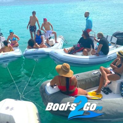a group of people on a boat in the water
