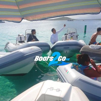 a group of people on a boat in the water