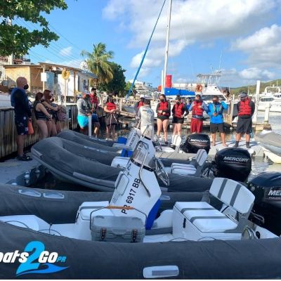 a group of people standing in a parking lot