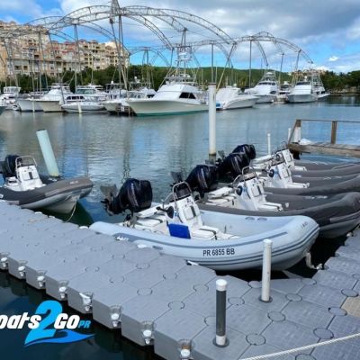 a boat that is sitting on a dock next to a body of water