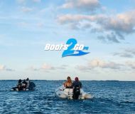 a group of people in a large body of water