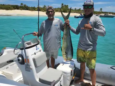 a couple of people on a boat in the water