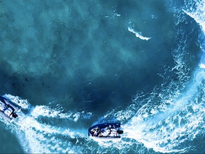 a person riding a wave on a surfboard in the water