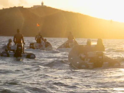 a group of people on a beach