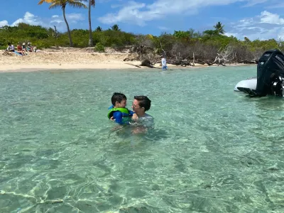 a group of people swimming in a body of water